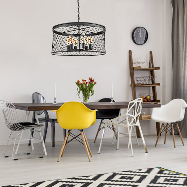 Matte black pendant light cage shade over dining table