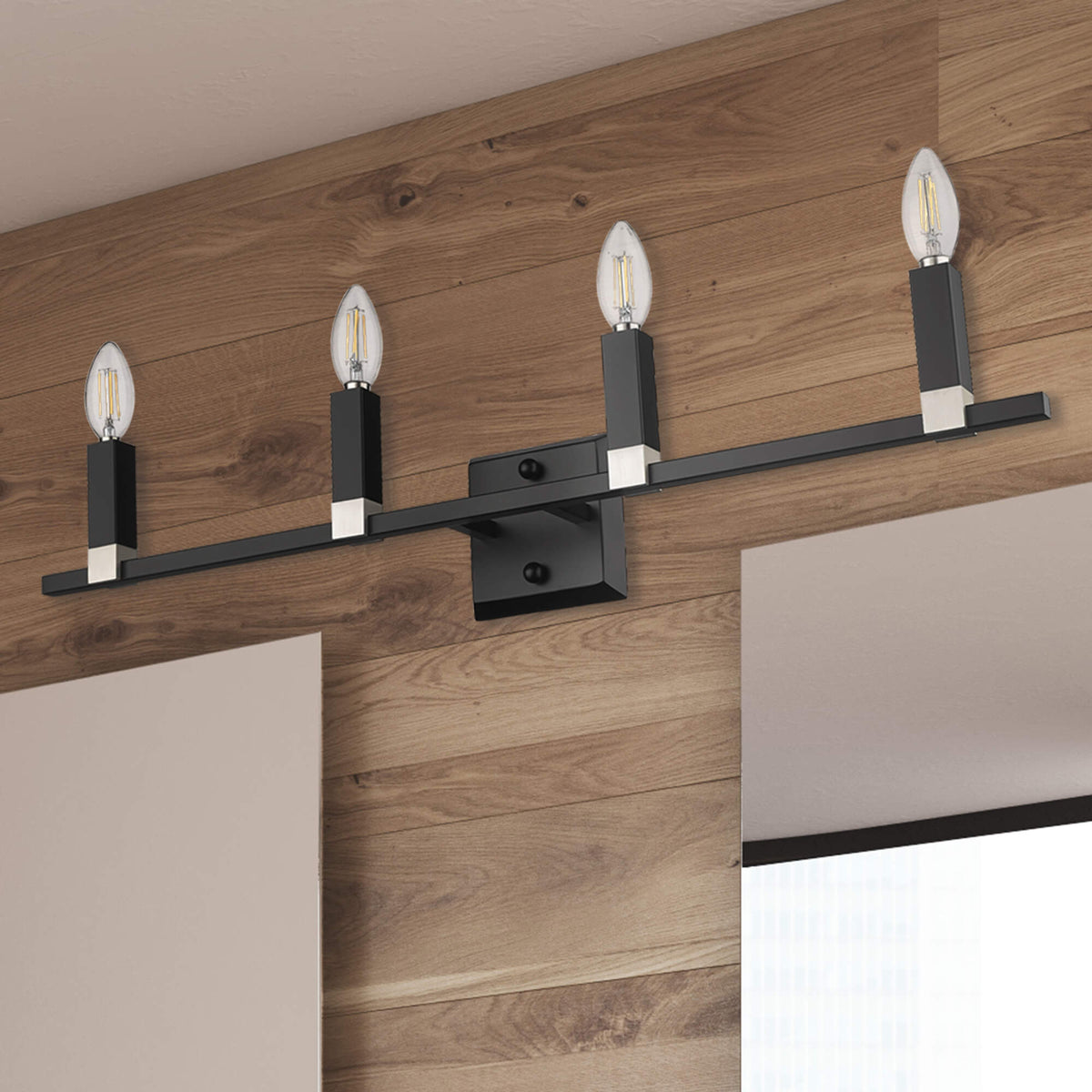 Modern black candle vanity light wall sconces over mirror