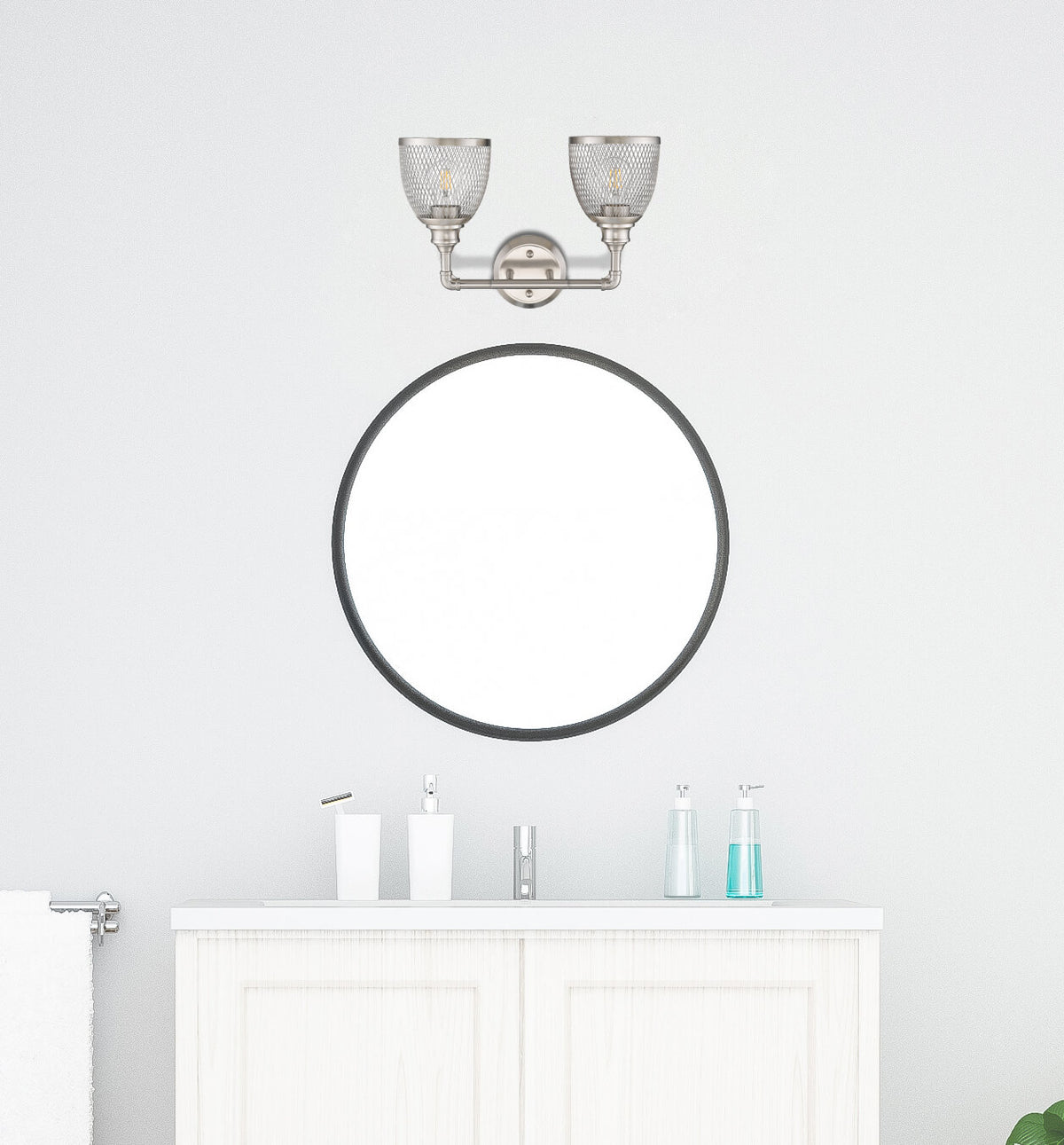 Brushed nickel bathroom vanity light fixtures over mirror