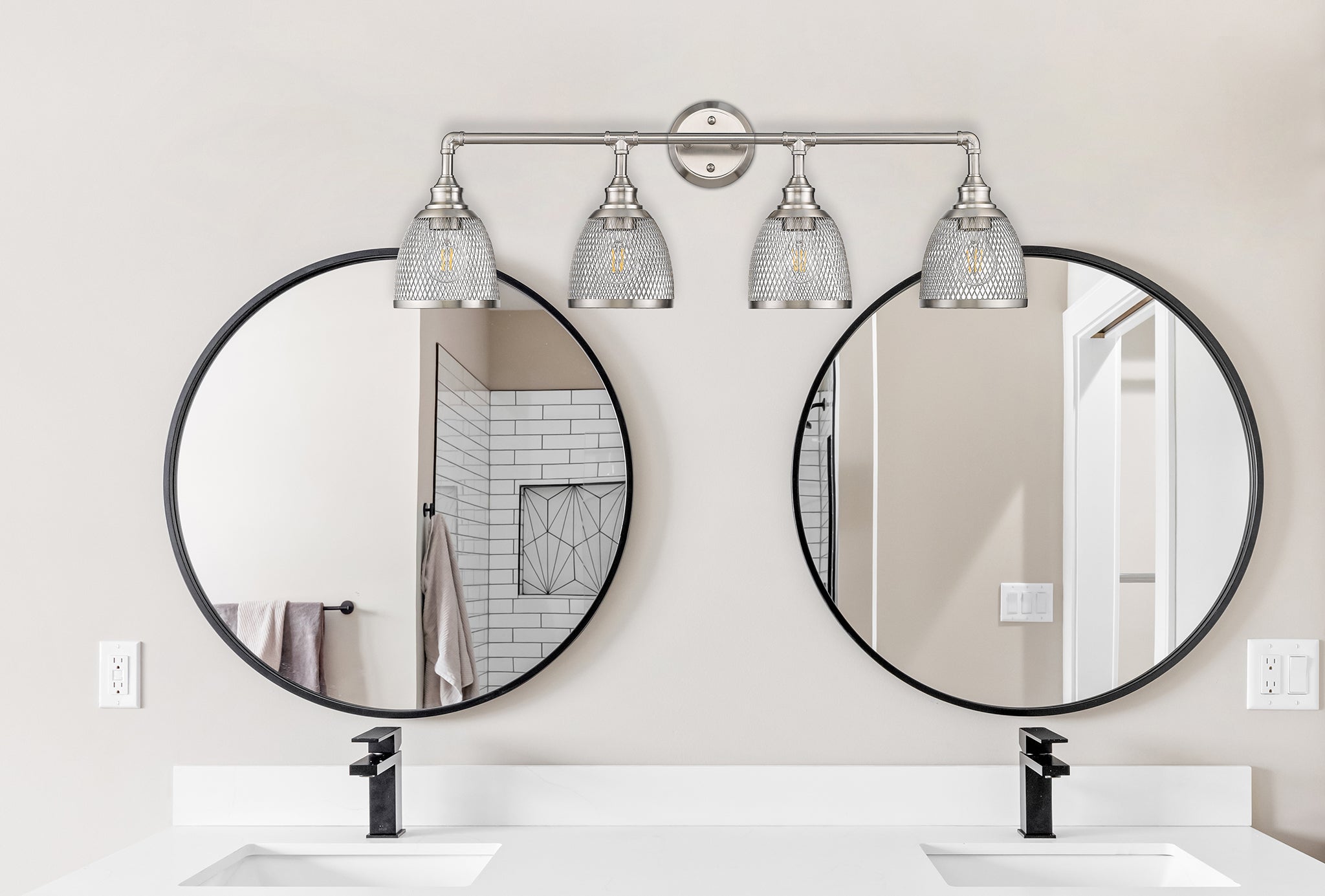 Brushed nickel bathroom vanity light fixtures over mirror