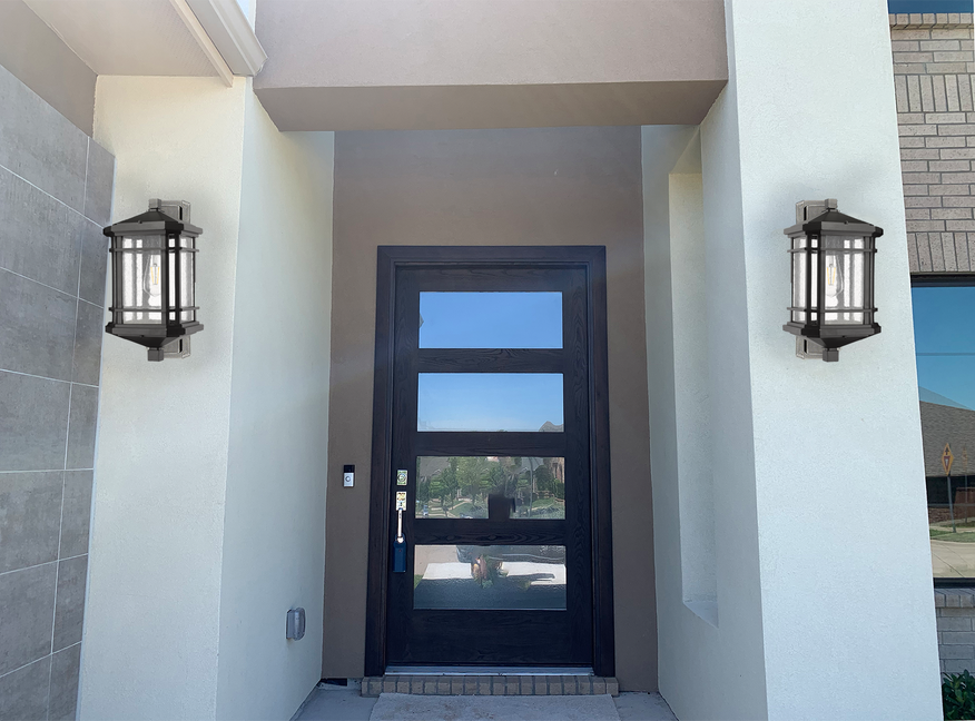 Modern black outdoor wall lantern lighting by front door